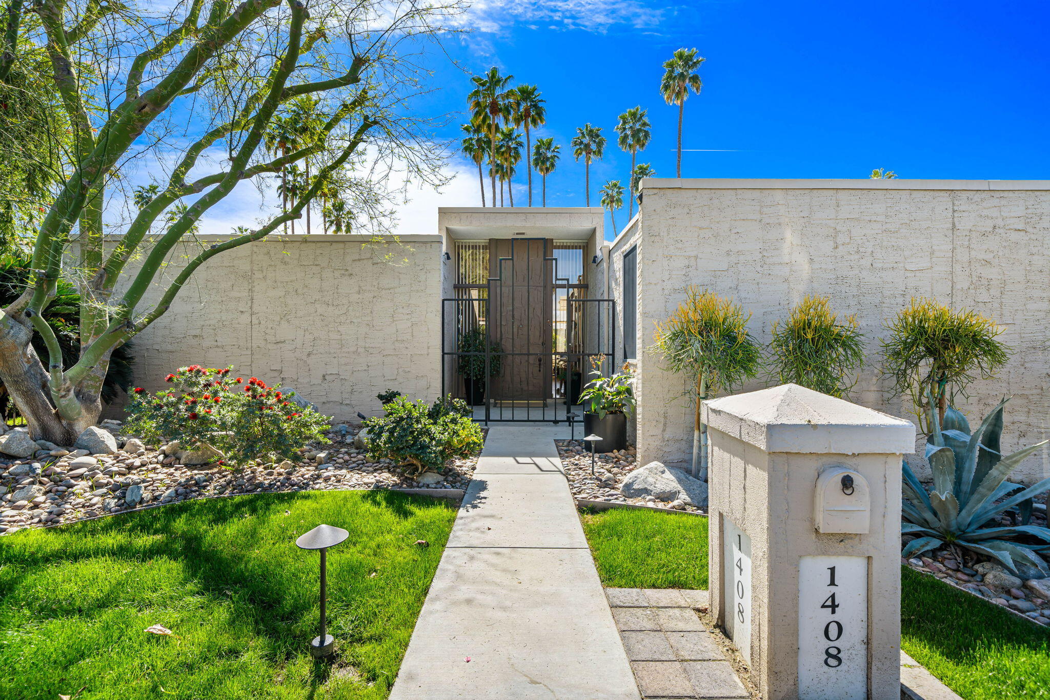 1408 Tamarisk W Street Rancho Mirage, CA 92270 - Photo 5 of 43 a view of a pathway with a house in front of it