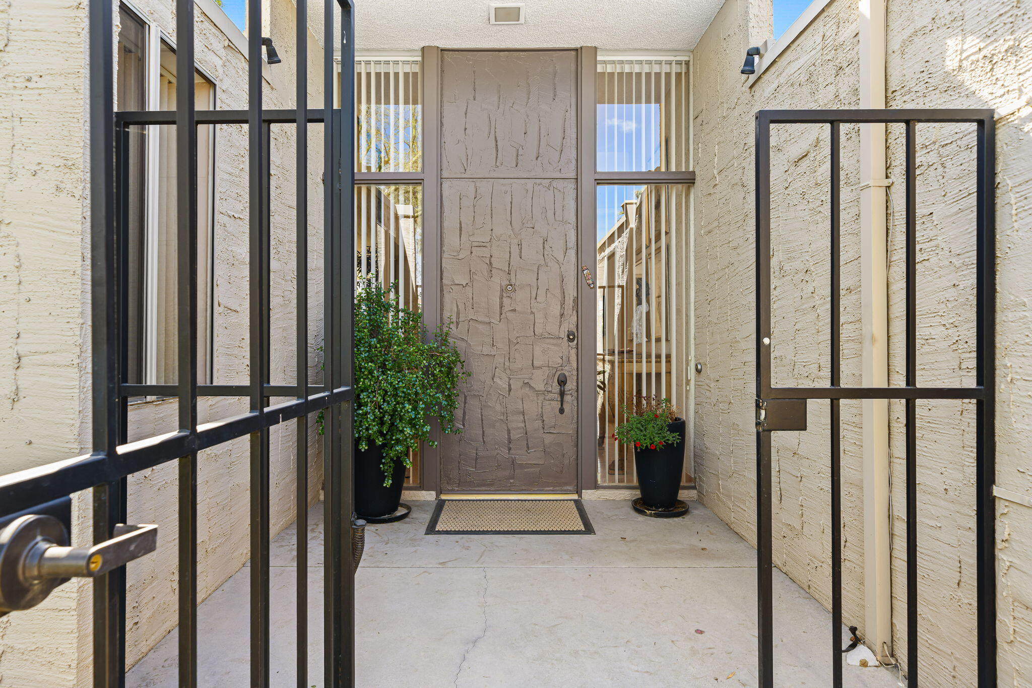 1408 Tamarisk W Street Rancho Mirage, CA 92270 - Photo 6 of 43 a view of entryway with wooden floor and windows