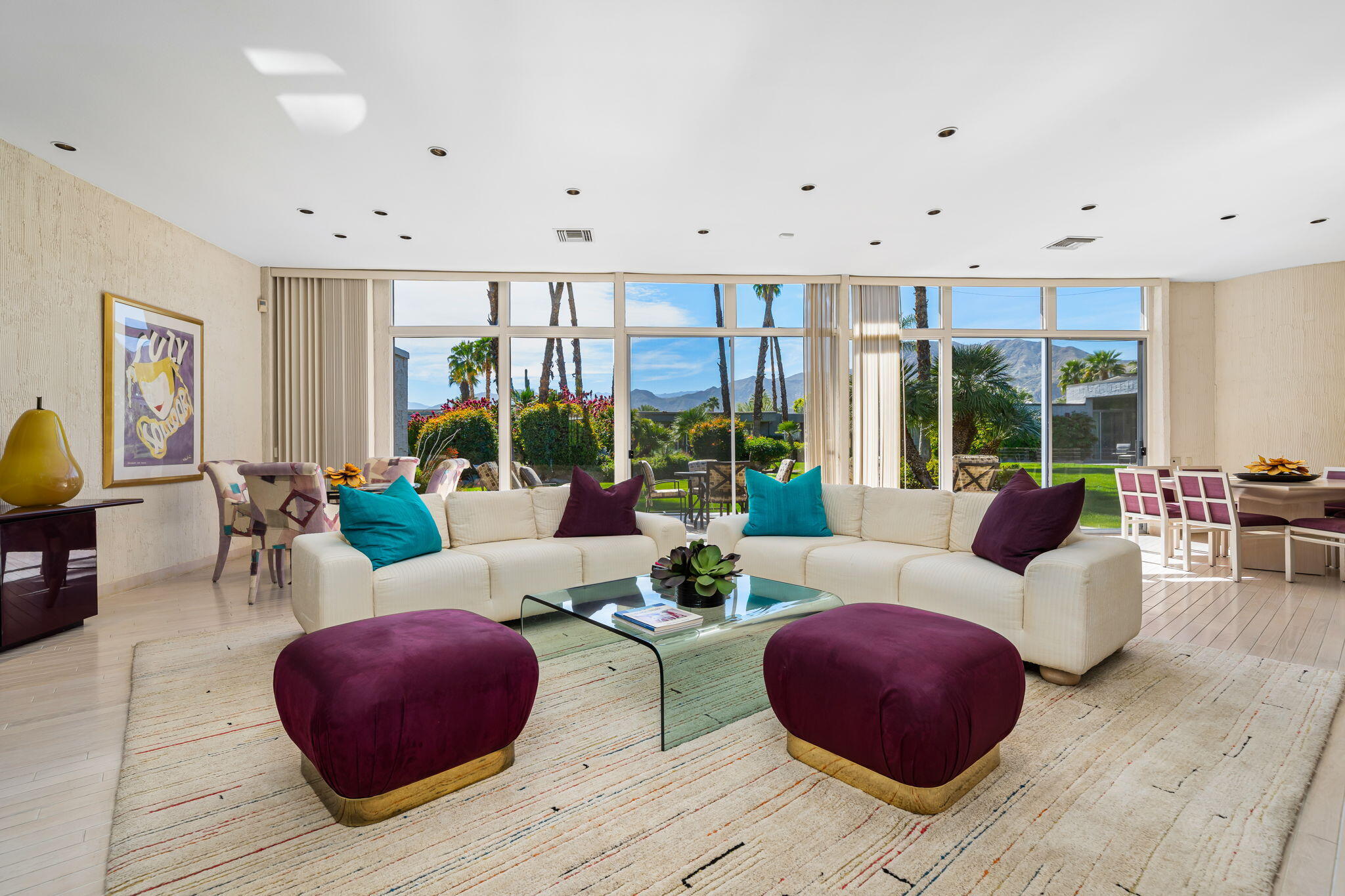 1408 Tamarisk W Street Rancho Mirage, CA 92270 - Photo 9 of 43 a living room with furniture and floor to ceiling windows