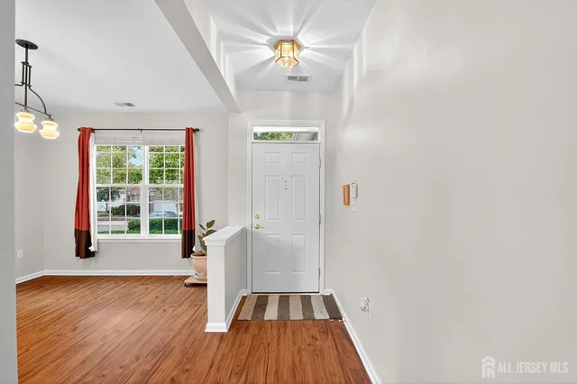 a view of entryway with wooden floor