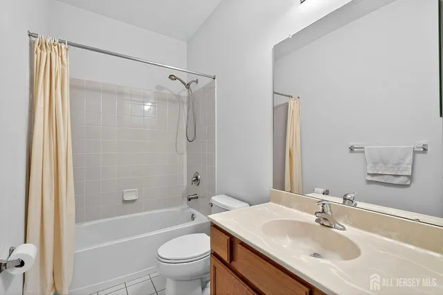 a view of a room with furniture and a window