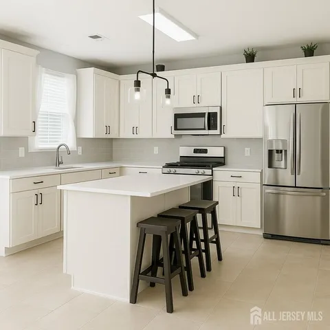 a bathroom with a tub sink and mirror