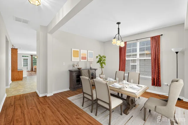 a dining room with furniture window wooden floor