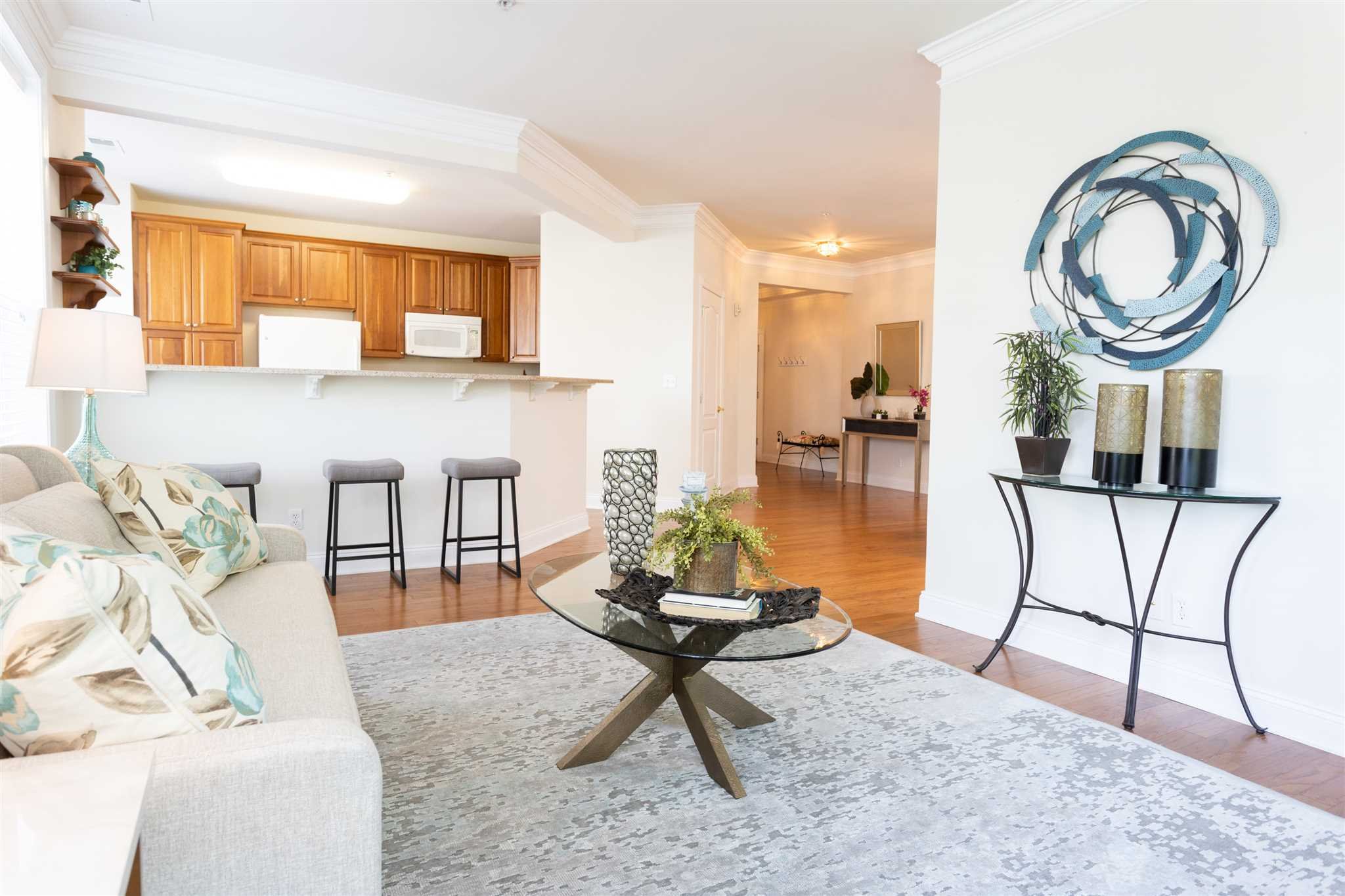 224 Regency Drive, Unit 224 Fishkill, NY 12524 - Photo 13 of 30 a living room with furniture a flat screen tv and a table
