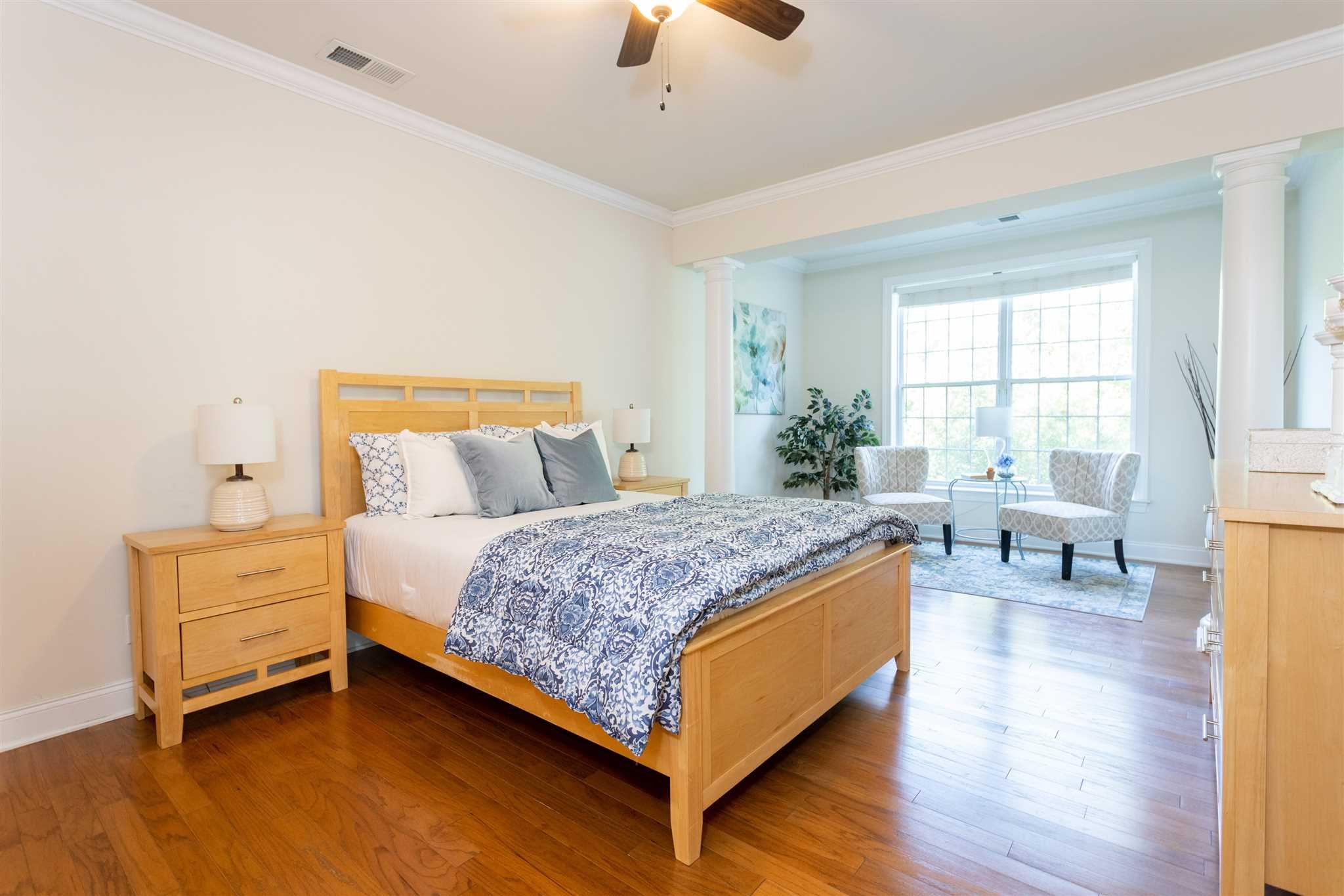 224 Regency Drive, Unit 224 Fishkill, NY 12524 - Photo 17 of 30 a bedroom with a bed and a chandelier