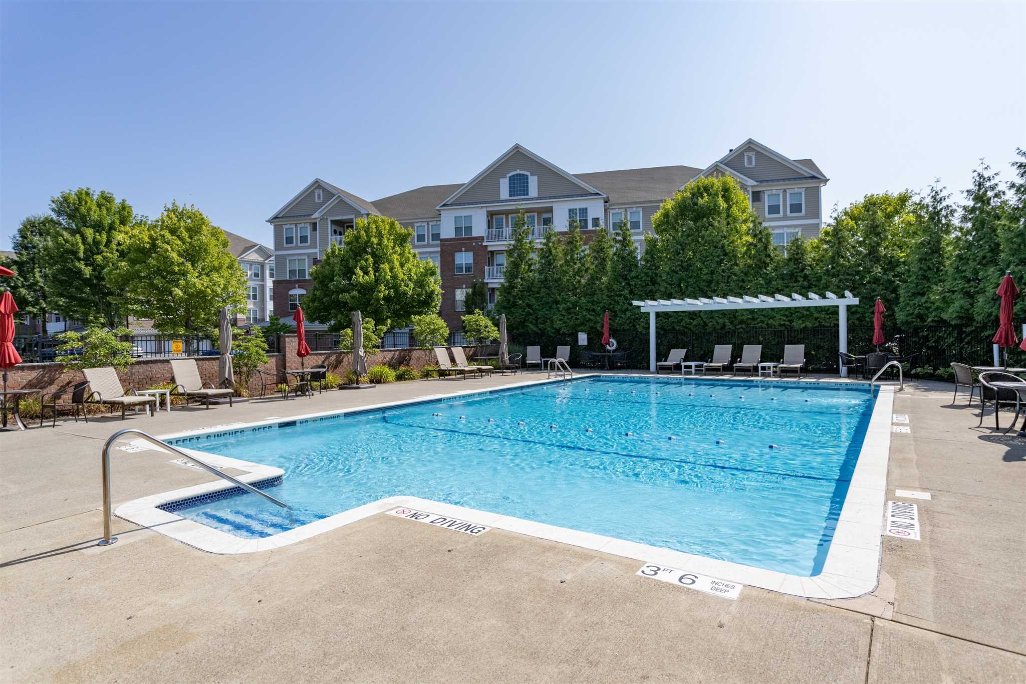 224 Regency Drive, Unit 224 Fishkill, NY 12524 - Photo 19 of 30 a view of a house with a swimming pool