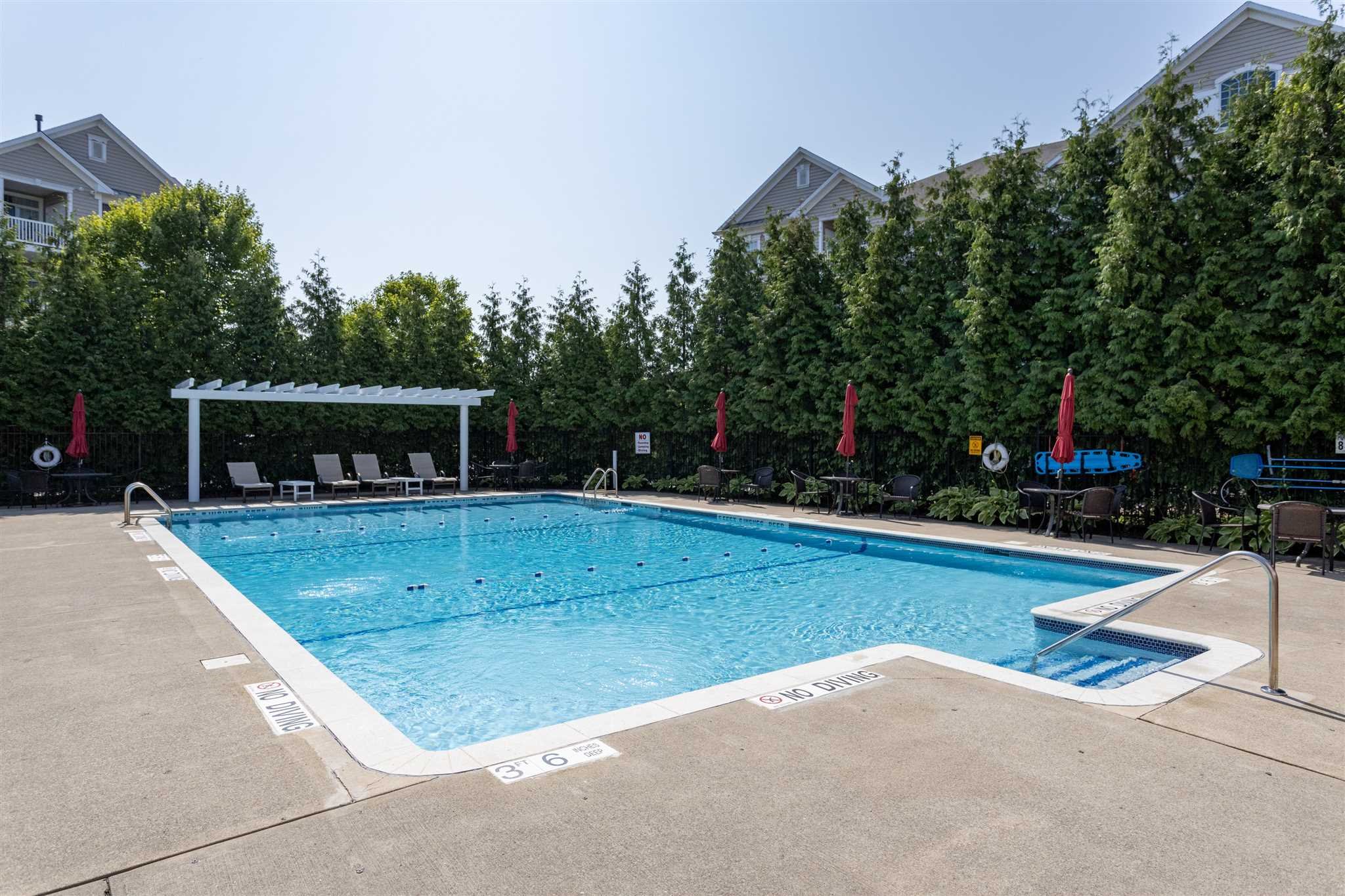 224 Regency Drive, Unit 224 Fishkill, NY 12524 - Photo 22 of 30 a view of a swimming pool with a yard