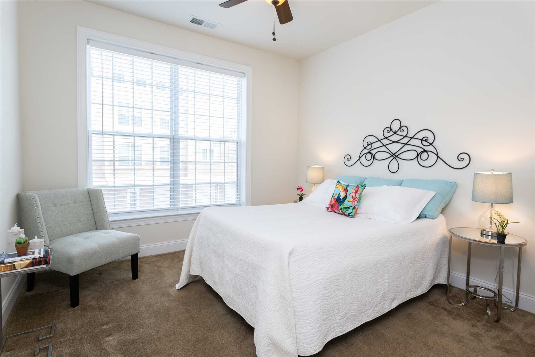 224 Regency Drive, Unit 224 Fishkill, NY 12524 - Photo 23 of 30 a bedroom with a bed and a couch