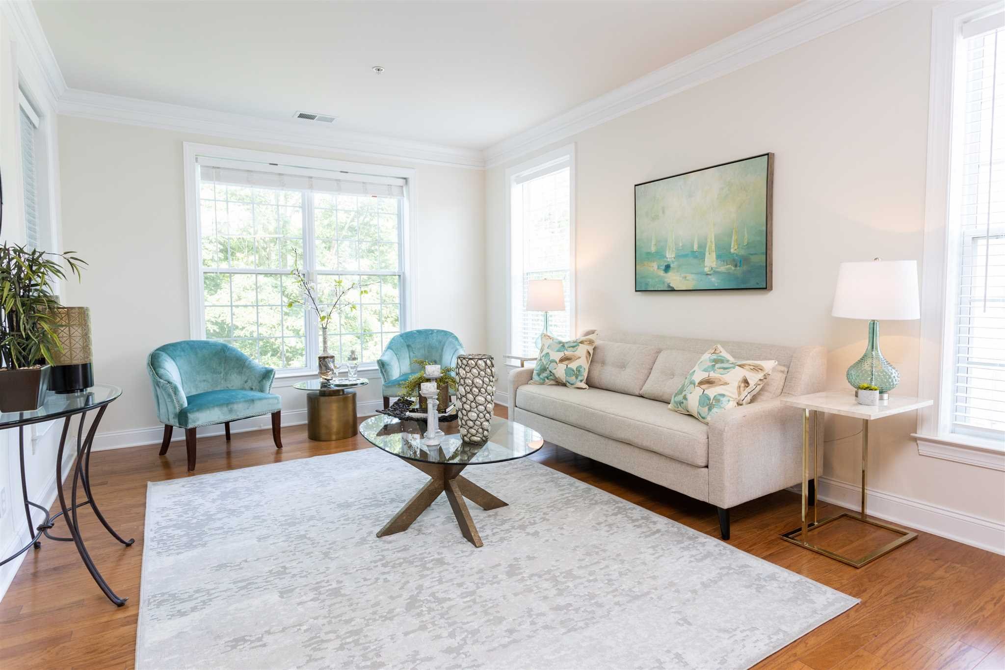 224 Regency Drive, Unit 224 Fishkill, NY 12524 - Photo 24 of 30 a living room with furniture a window and a table