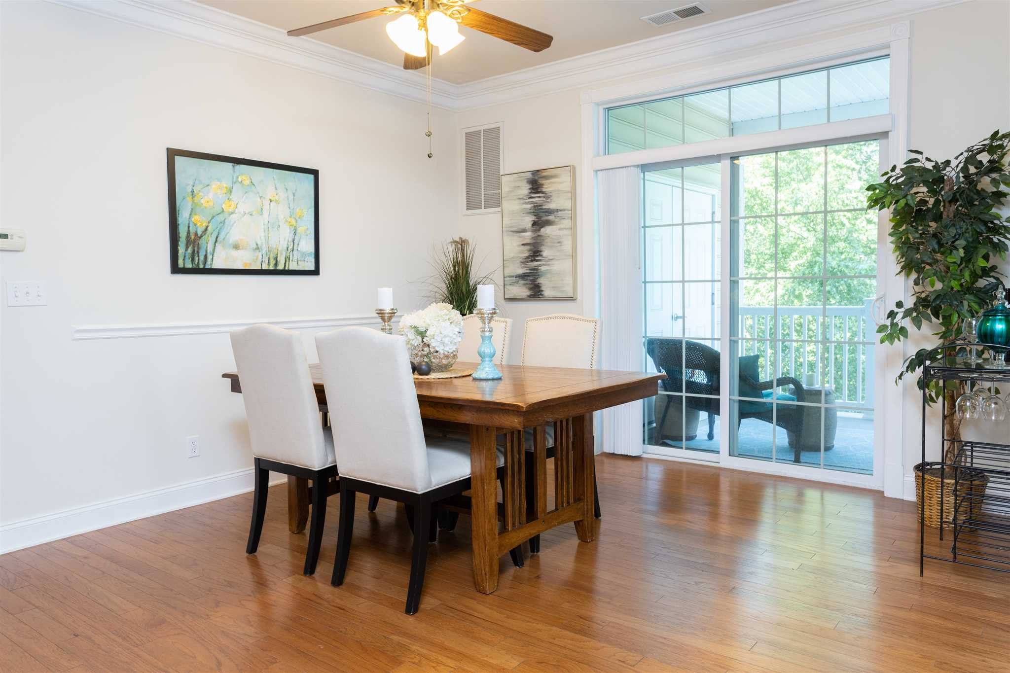 224 Regency Drive, Unit 224 Fishkill, NY 12524 - Photo 27 of 30 a view of a dining room with furniture window and wooden floor