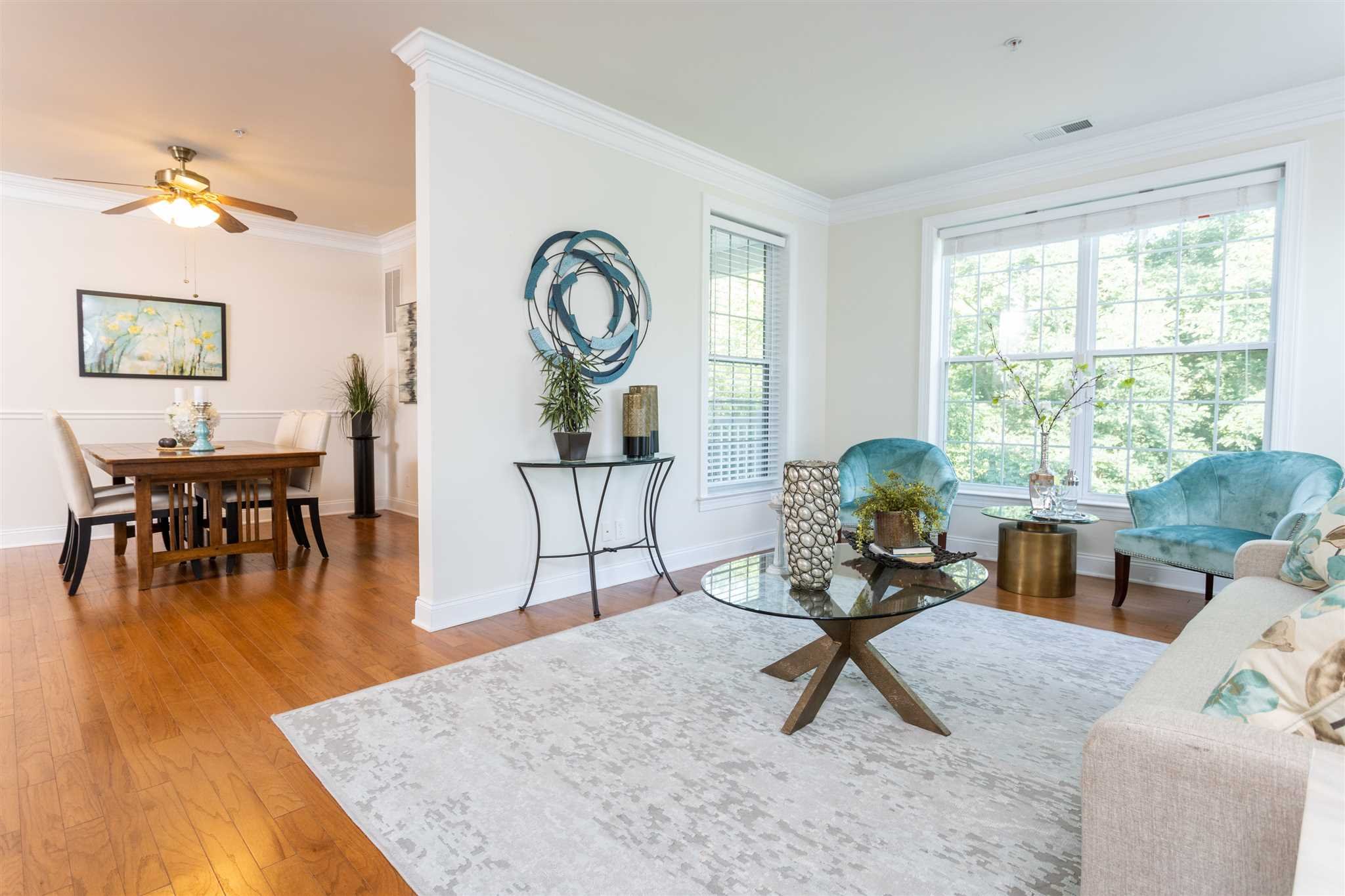 224 Regency Drive, Unit 224 Fishkill, NY 12524 - Photo 29 of 30 a living room with furniture and wooden floor