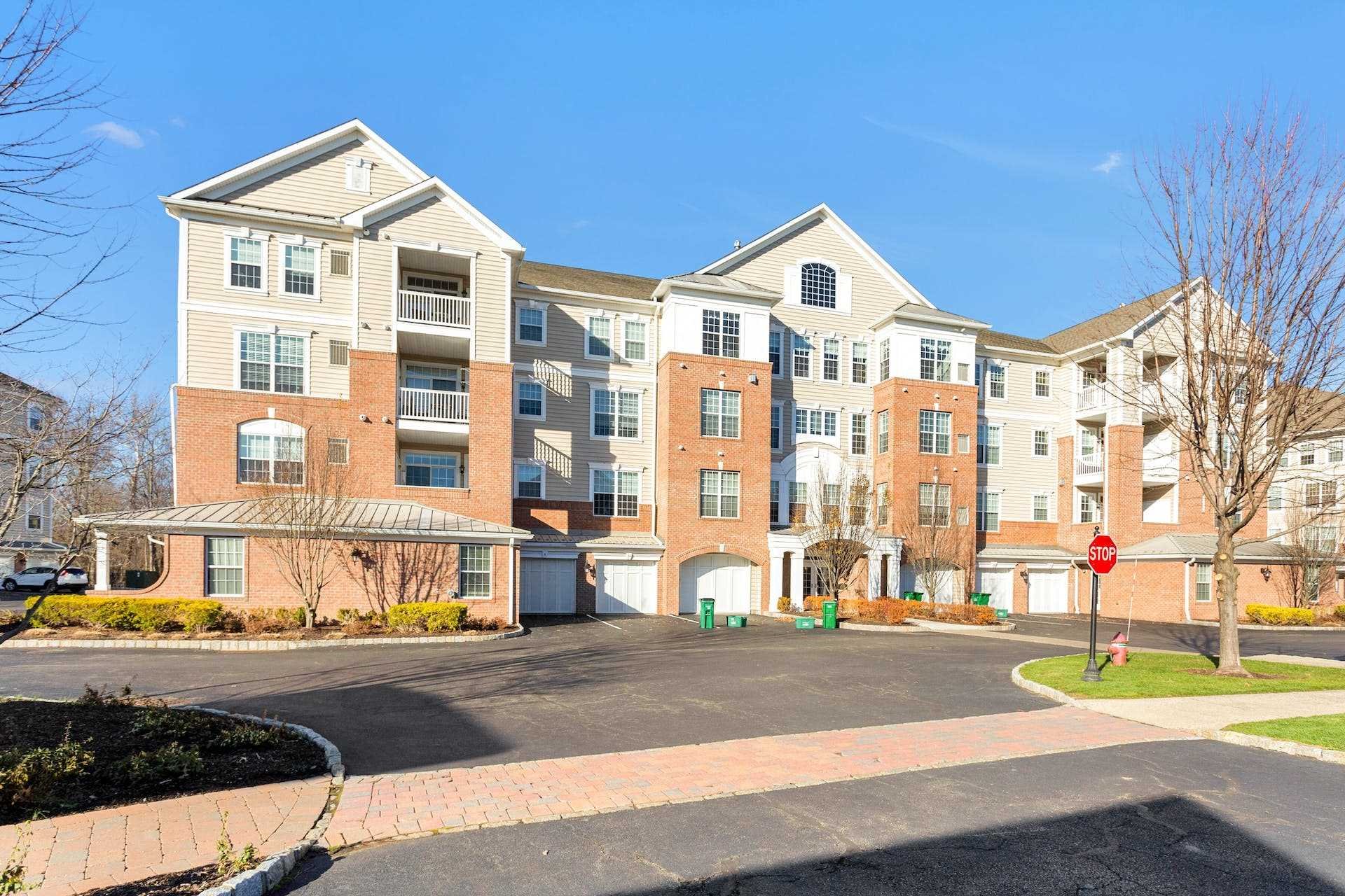 224 Regency Drive, Unit 224 Fishkill, NY 12524 - Photo 6 of 30 a front view of a building with street