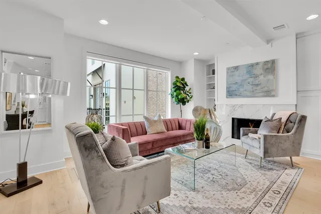 a view of a workspace with furniture and wooden floor