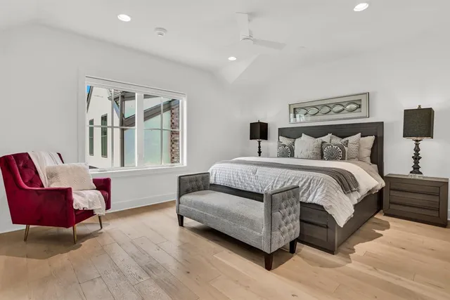 a bathroom with a granite countertop sink a toilet and shower