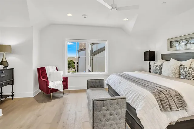 a bedroom with a bed and a night stand