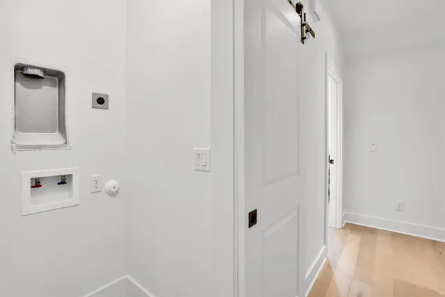 a view of a livingroom with white walls