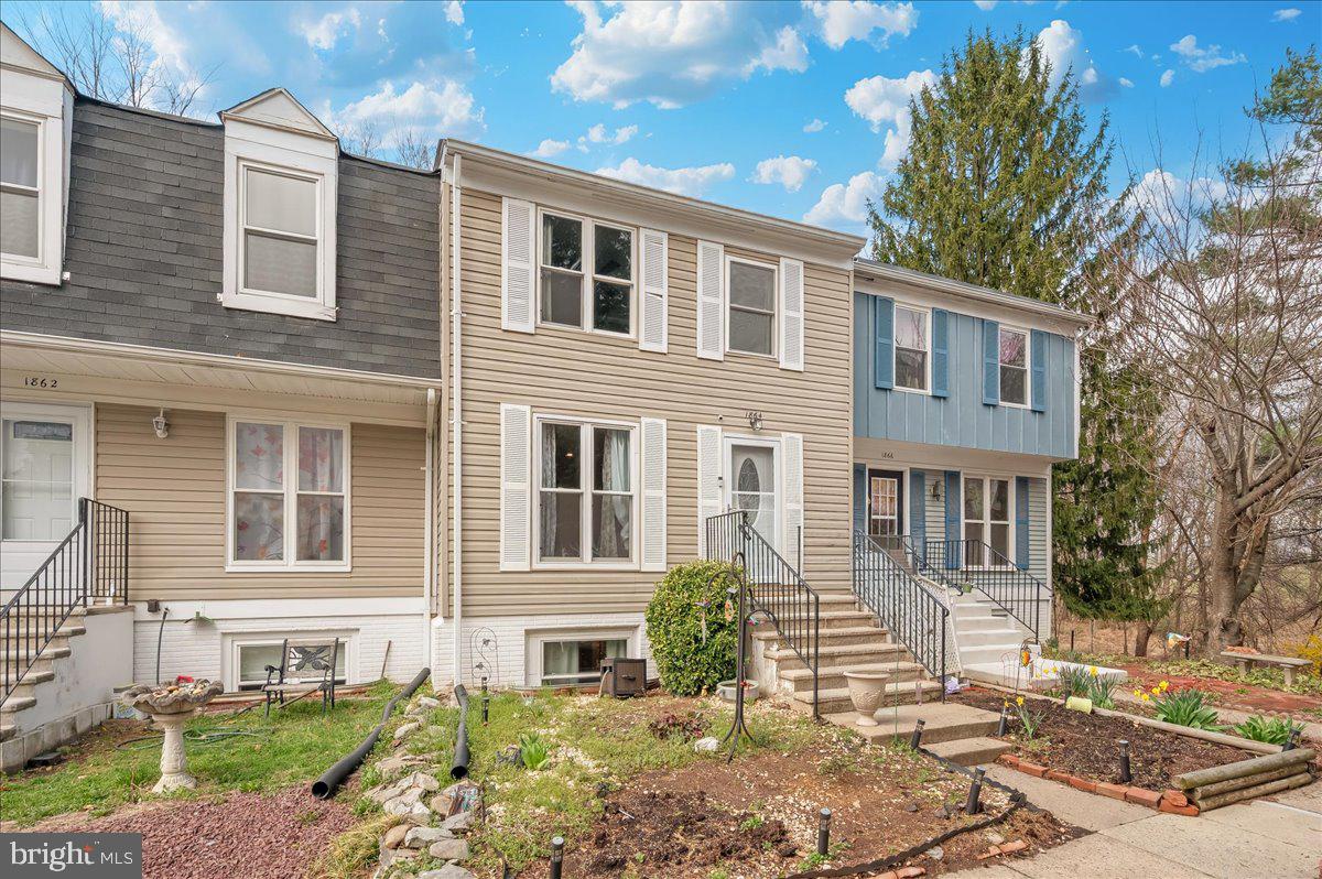 1864 Murdock Court Frederick, MD 21702 - Photo 1 of 39 a front view of a house with a garden