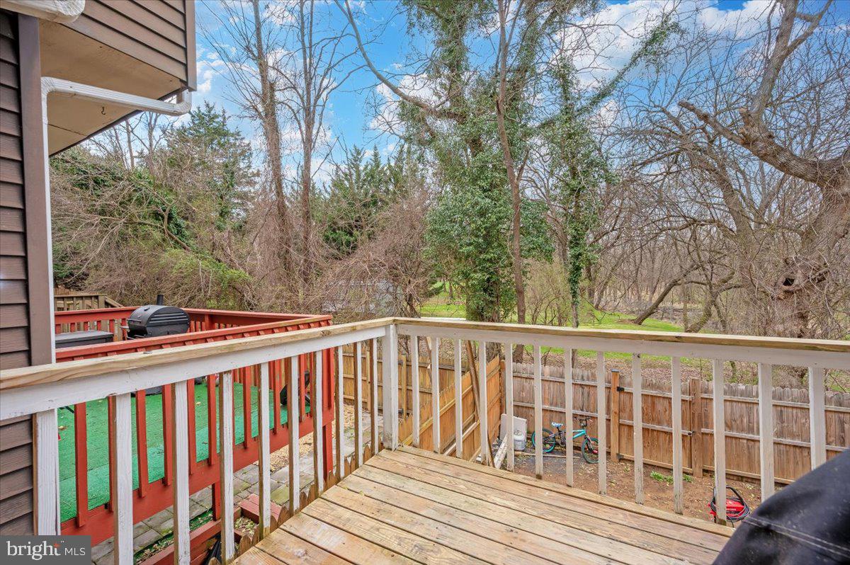 1864 Murdock Court Frederick, MD 21702 - Photo 14 of 39 a view of a wooden deck with large trees
