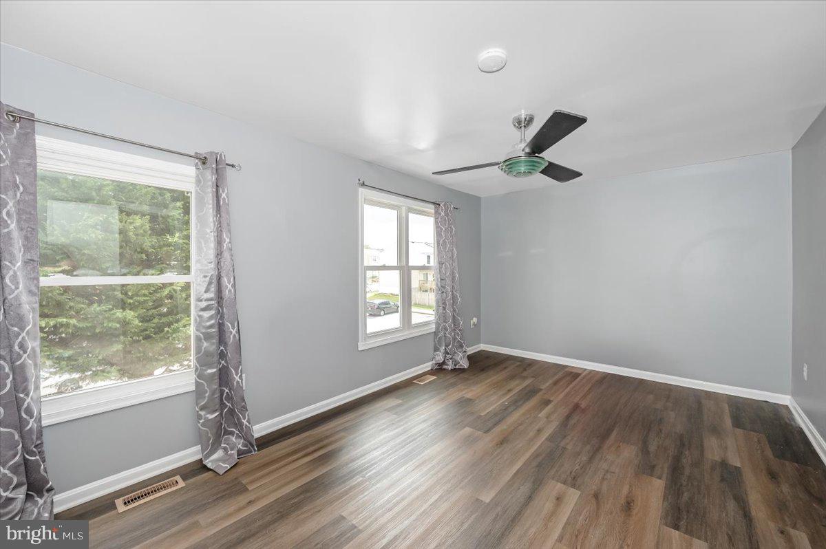 1864 Murdock Court Frederick, MD 21702 - Photo 15 of 39 an empty room with wooden floor and windows