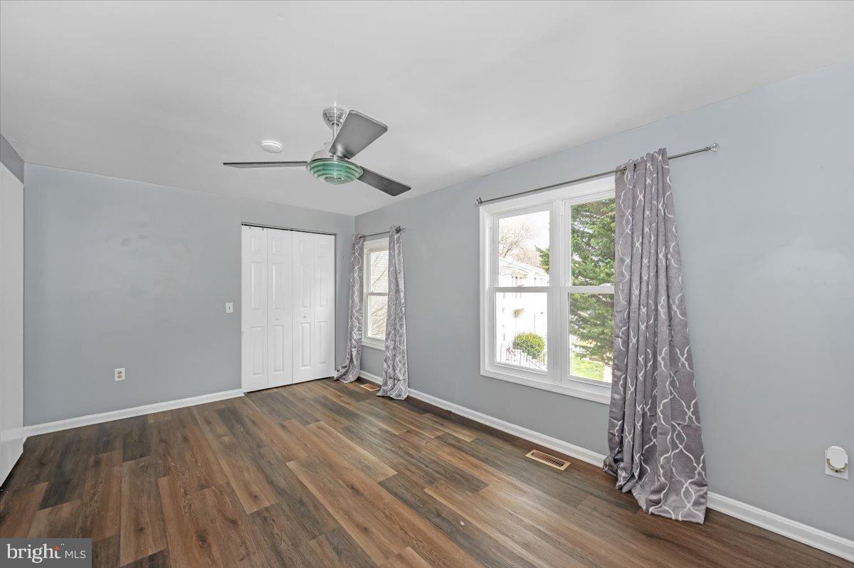 1864 Murdock Court Frederick, MD 21702 - Photo 16 of 39 a view of an empty room with wooden floor and a window