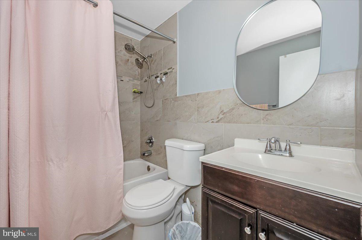 1864 Murdock Court Frederick, MD 21702 - Photo 22 of 39 a bathroom with a sink a toilet and shower