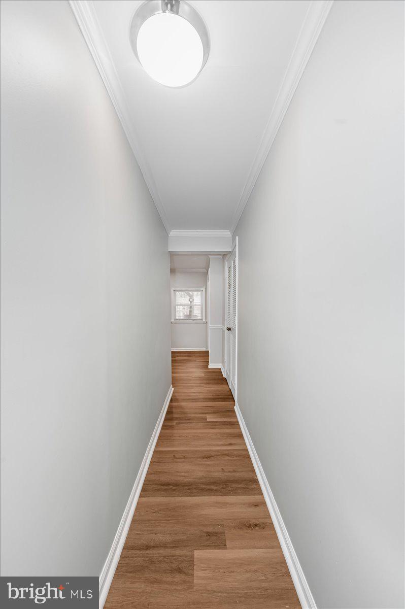1864 Murdock Court Frederick, MD 21702 - Photo 24 of 39 a view of a hallway with wooden floor and staircase