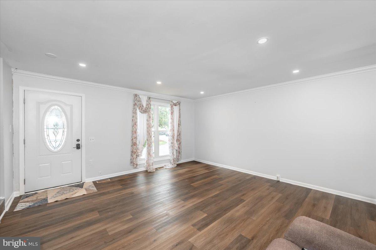 1864 Murdock Court Frederick, MD 21702 - Photo 3 of 39 an empty room with wooden floor and window