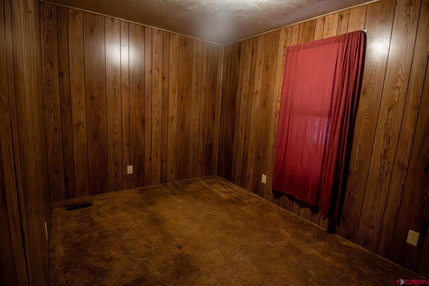 17240 Rd G Cortez, CO 81321 - Photo 21 of 37 a view of a elevator with wooden walls