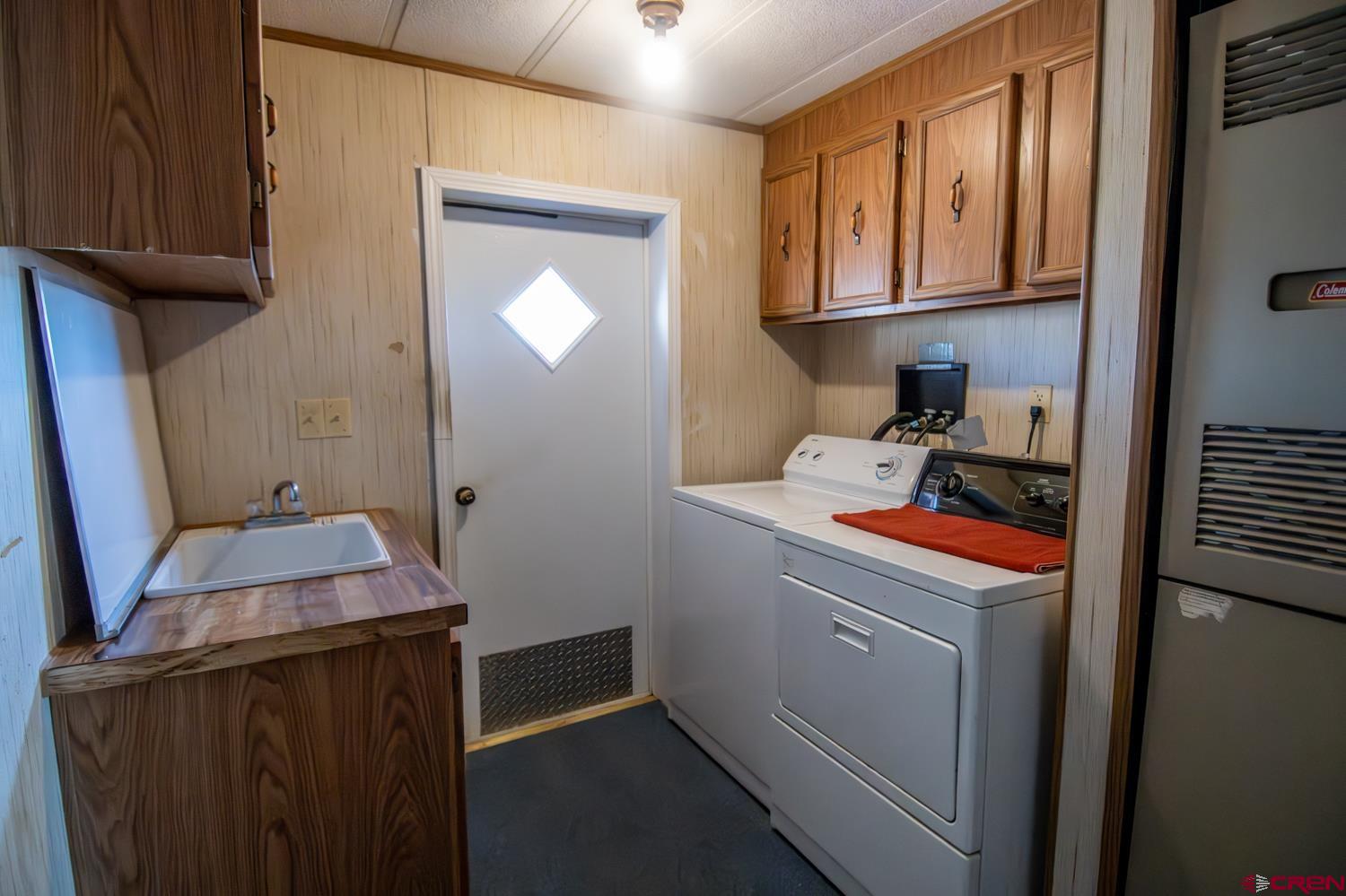 17240 Rd G Cortez, CO 81321 - Photo 25 of 37 a room with storage and utility