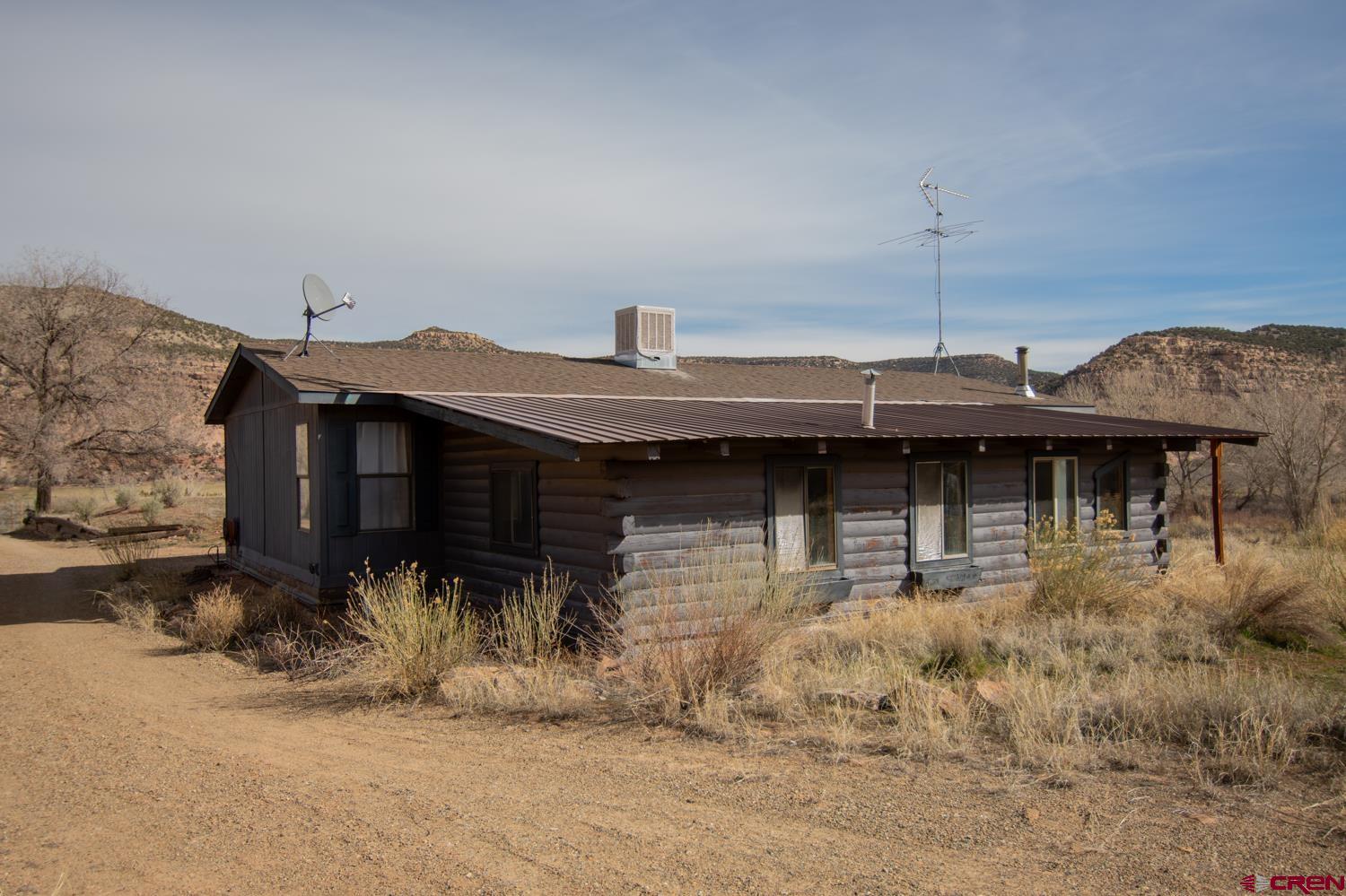 17240 Rd G Cortez, CO 81321 - Photo 31 of 37 a front view of a house with a yard