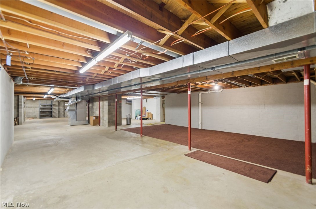 200 Hampshire Road Akron, OH 44313 - Photo 41 of 50 Expansive unfinished basement featuring concrete flooring and exposed ceiling joists