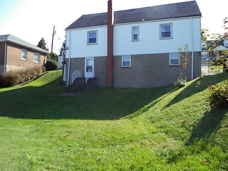 1237 Rosecrest Avenue Monessen, PA 15062 - Photo 15 of 17 Exterior Front. A view of the back of the house and the huge yard
