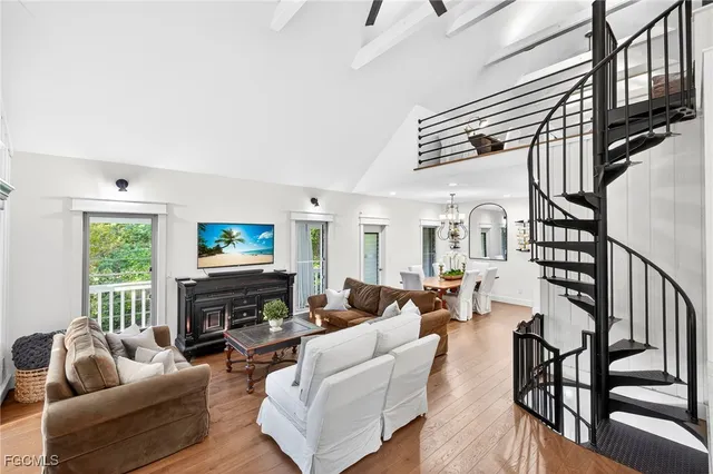 a living room with fireplace furniture and a flat screen tv