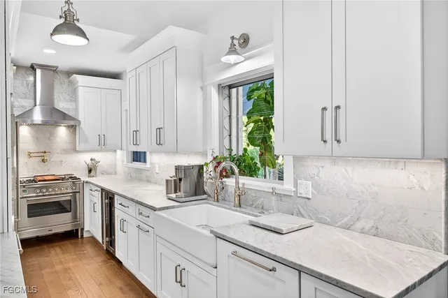 a kitchen with a sink stove and cabinets