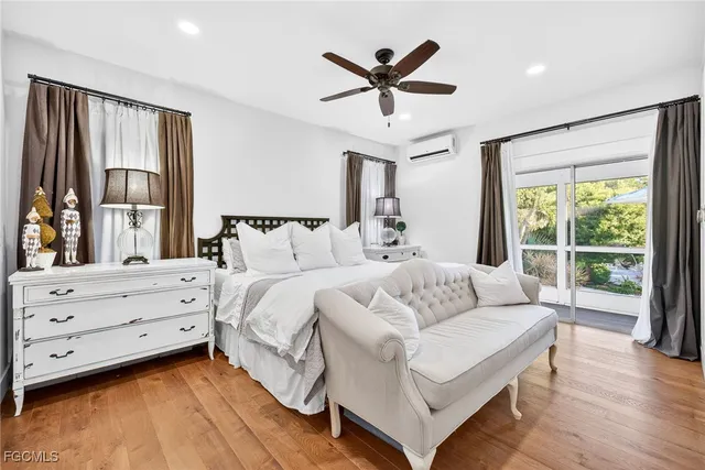 a bed room with a bed and a large window