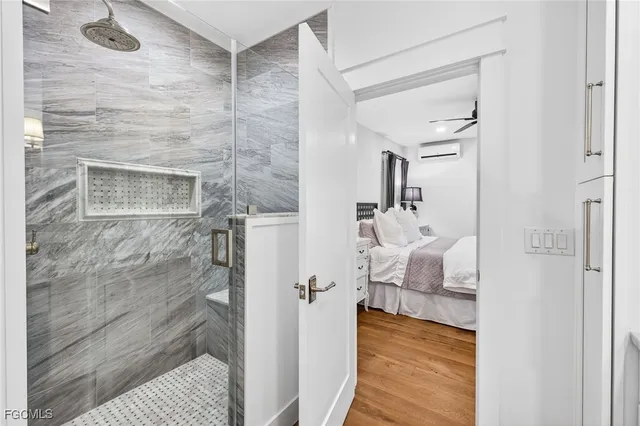 a bathroom with a sink and glass door