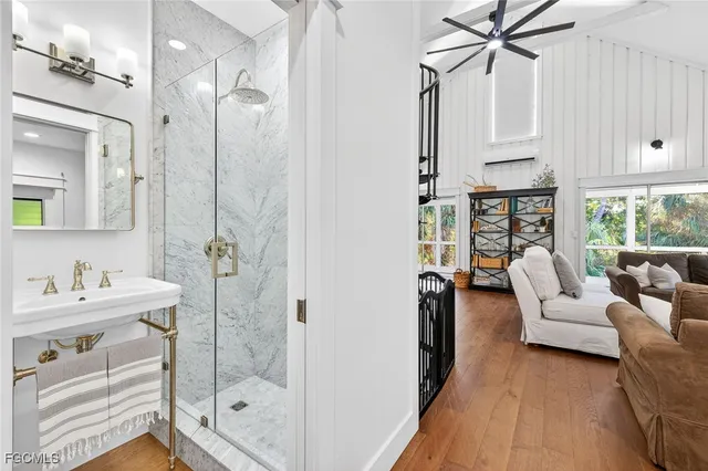a bathroom with a sink toilet and mirror