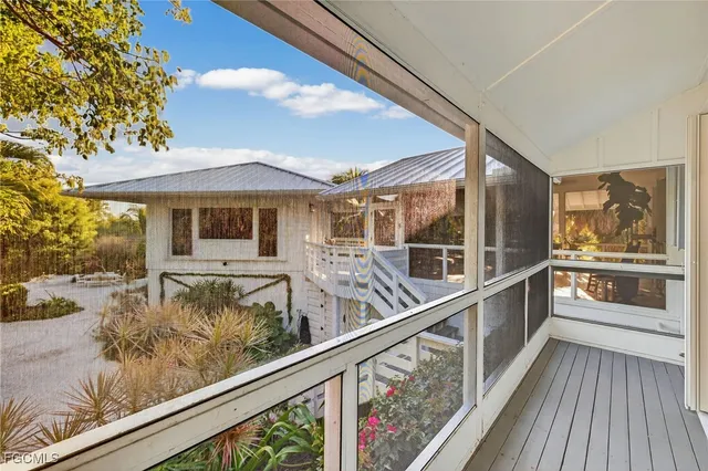 a view of a balcony with wooden floor