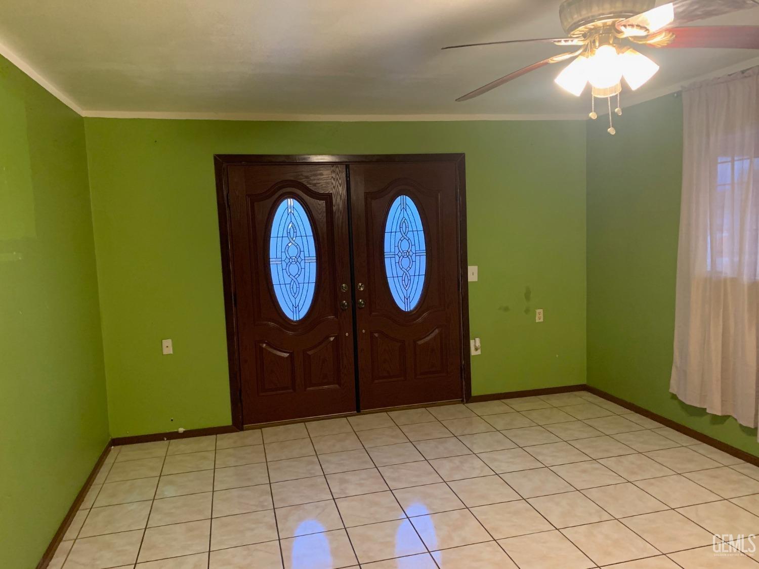 Undisclosed Address Lamont, CA 93241 - Photo 3 of 10 a front view of a house with garden