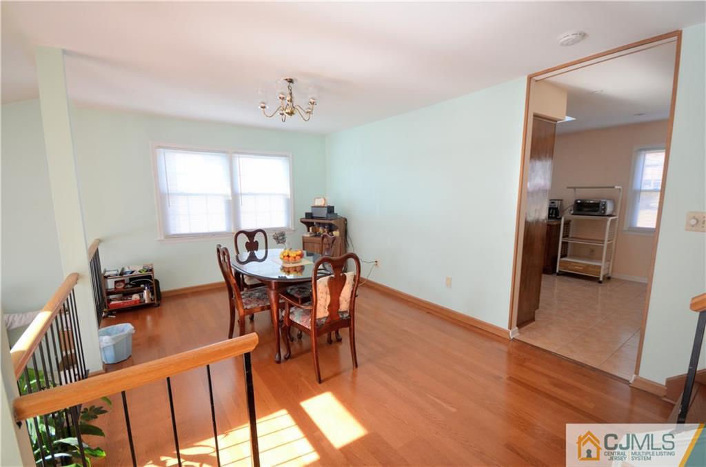 2 Ridge Road Edison, NJ 08817 - Photo 4 of 18 a view of a dining room with furniture window and wooden floor