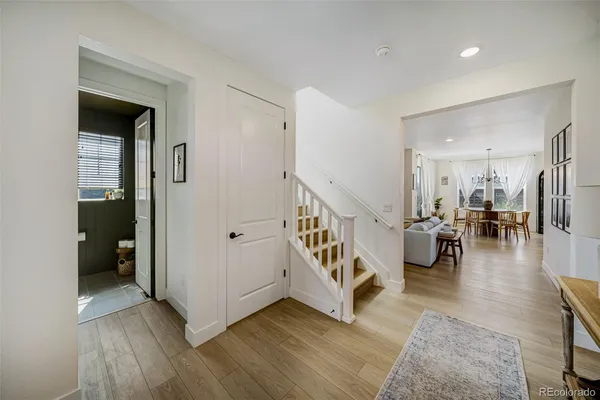 a view of dining room with wooden floor and furniture