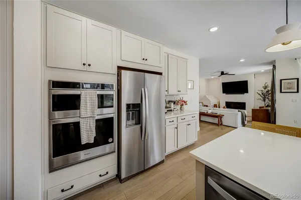 a kitchen with a refrigerator stove and microwave