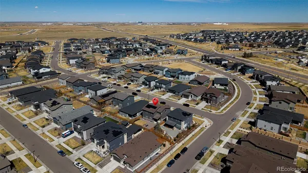 an aerial view of a residential apartment building with parking