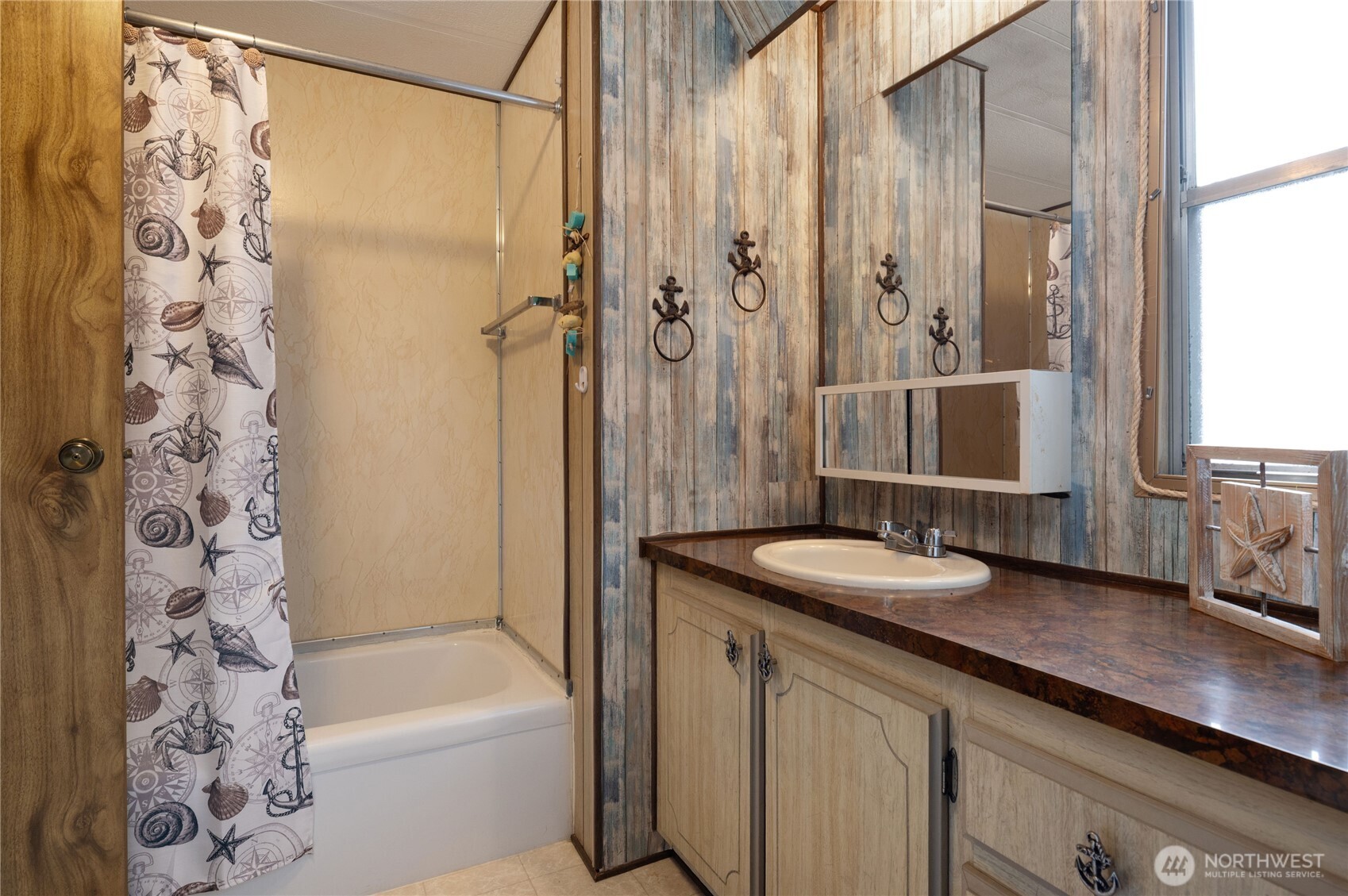 71 Bald Point Court Tahuya, WA 98588 - Photo 16 of 32 a bathroom with a granite countertop sink a toilet and shower