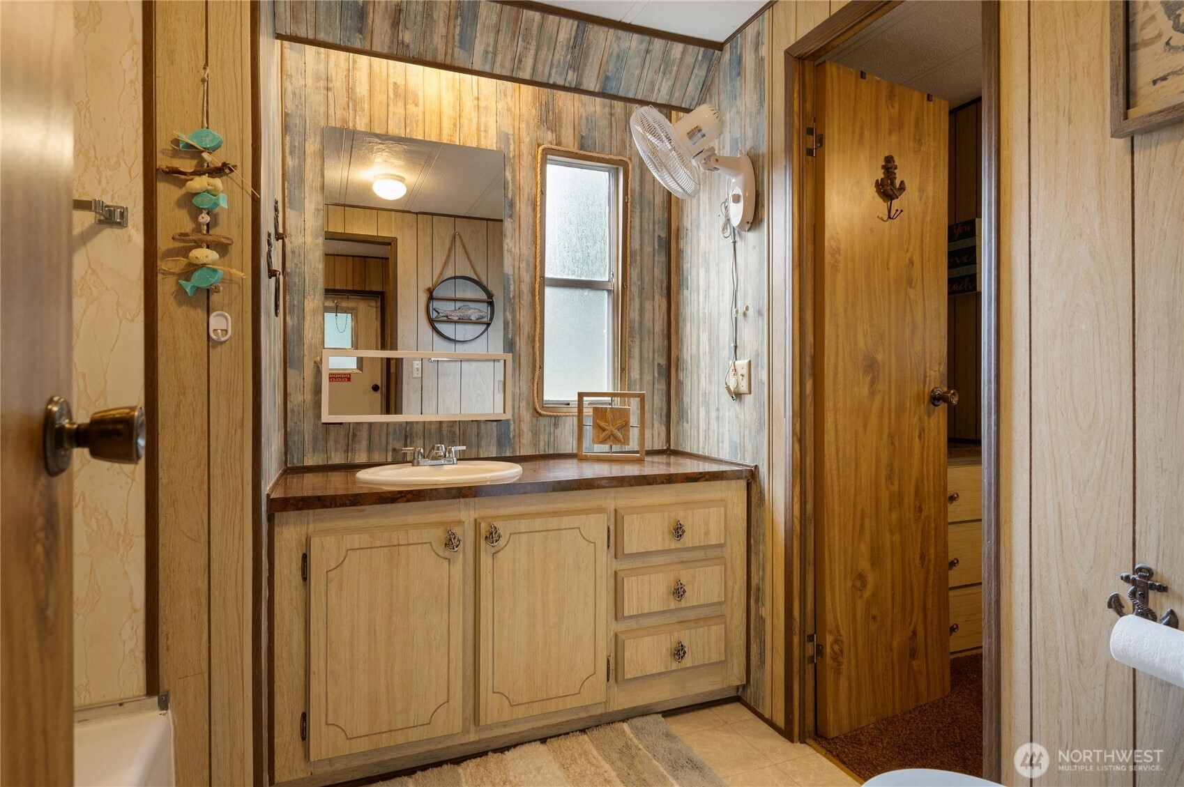 71 Bald Point Court Tahuya, WA 98588 - Photo 17 of 32 a bathroom with a granite countertop sink and a mirror