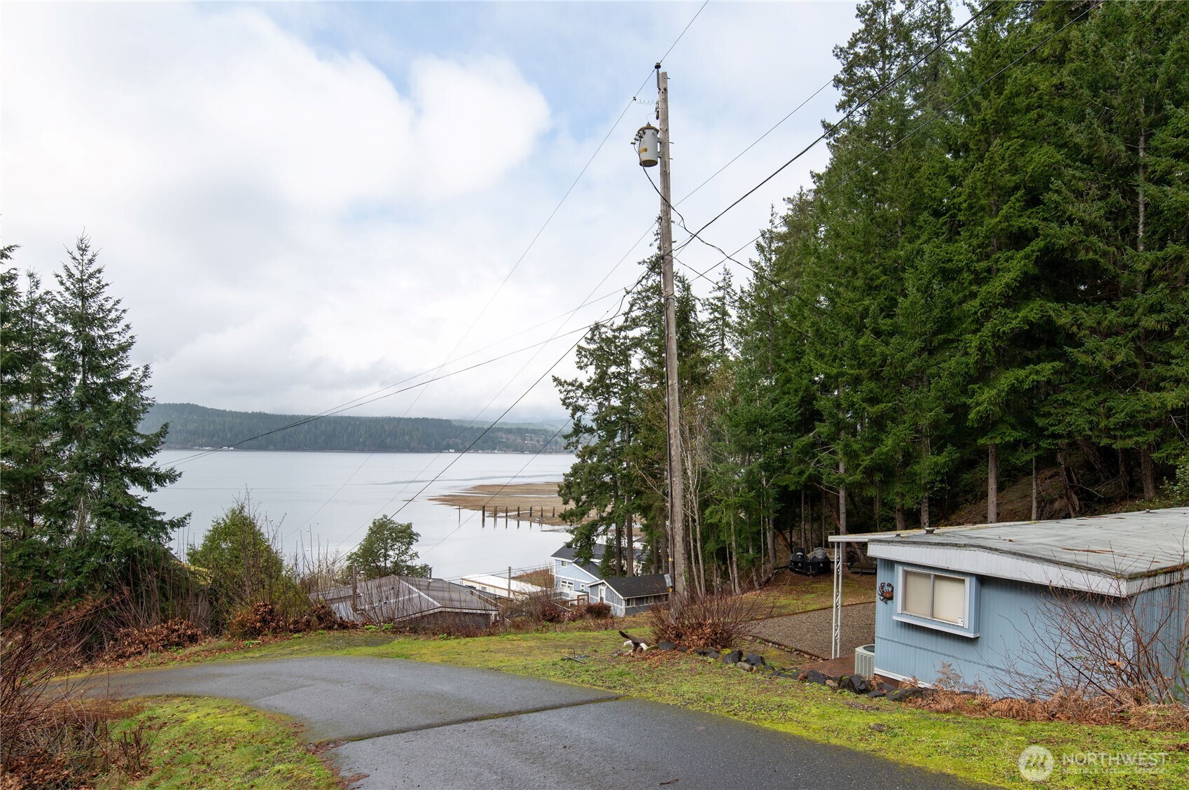71 Bald Point Court Tahuya, WA 98588 - Photo 22 of 32 a view of a house with backyard and sitting area