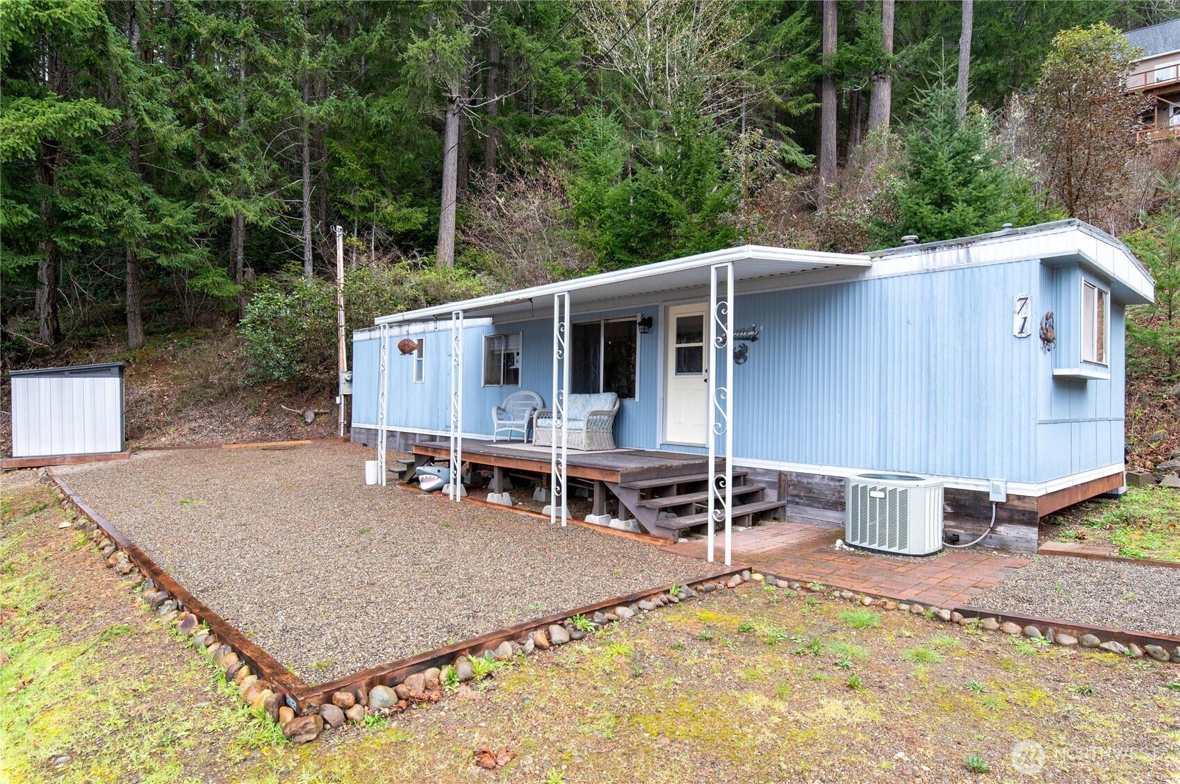 71 Bald Point Court Tahuya, WA 98588 - Photo 23 of 32 a backyard of a house with table and chairs