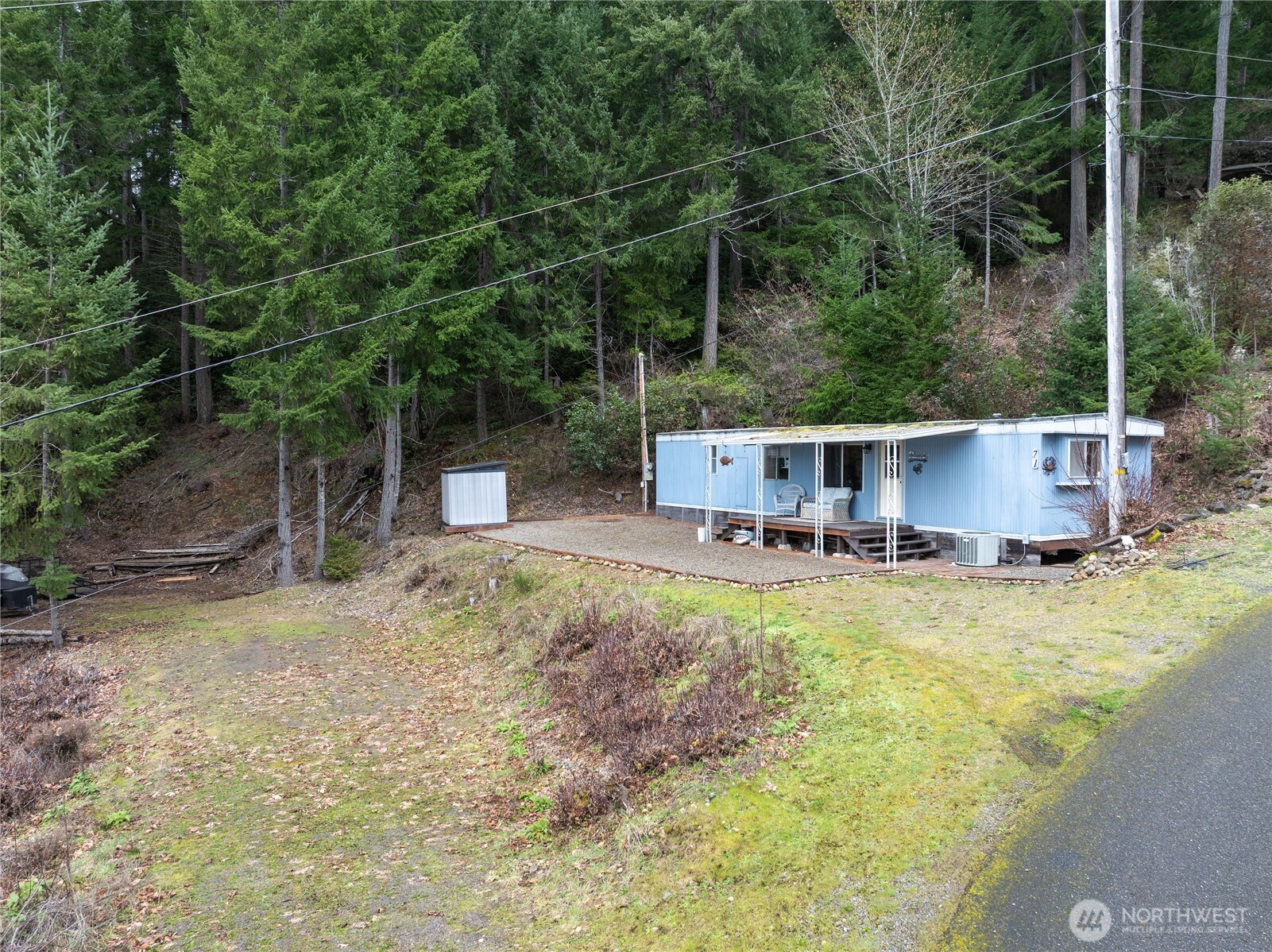 71 Bald Point Court Tahuya, WA 98588 - Photo 26 of 32 a view of house with swimming pool and furniture
