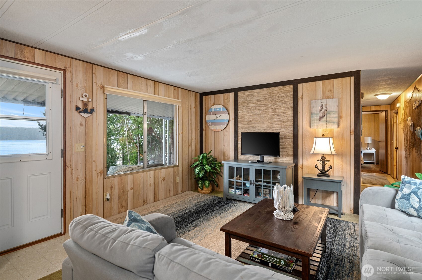 71 Bald Point Court Tahuya, WA 98588 - Photo 4 of 32 a living room with furniture fireplace and a flat screen tv