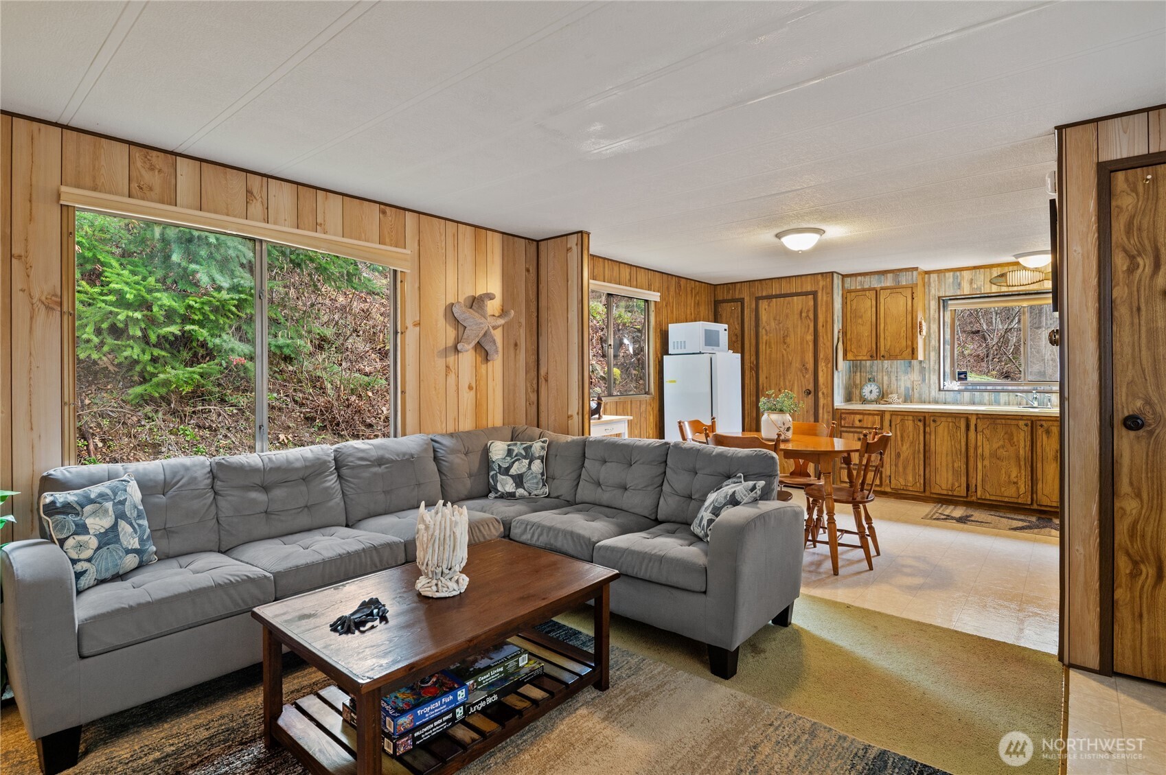 71 Bald Point Court Tahuya, WA 98588 - Photo 6 of 32 a living room with furniture and a large window